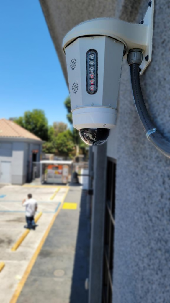 Security camera on a poll in a parking lot
