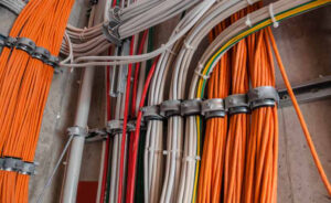 Organized low voltage and structured cabling installed inside a commercial building.
