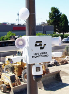 OnView Active Deterrent Unit with surveillance cameras and speakers installed at an active construction site.