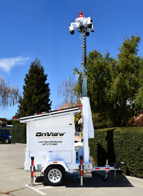 OnView Mobile Surveillance Trailer with an elevated camera mast deployed at a client property.