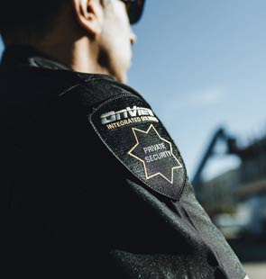 Close-up of an OnView security officer uniform with a Private Security shoulder patch.